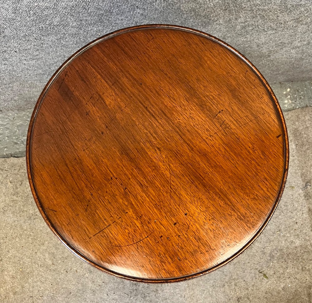 A circular mahogany revolving book mill table featuring a central turned column, four spindled book compartments, and a quadruped base. View II
