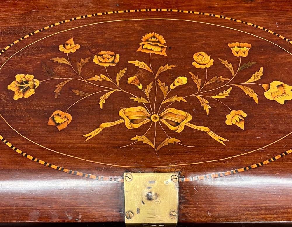 An antique Dutch marquetry writing bureau crafted from mahogany with detailed floral wood inlays, brass drop handles, and claw feet. View XI
