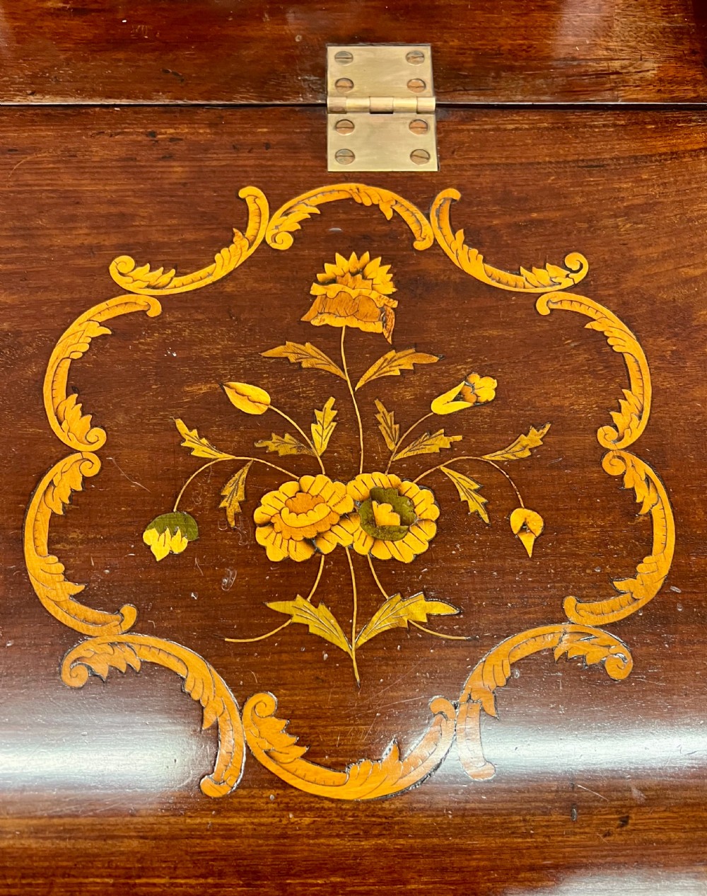 An antique Dutch marquetry writing bureau crafted from mahogany with detailed floral wood inlays, brass drop handles, and claw feet. View XII