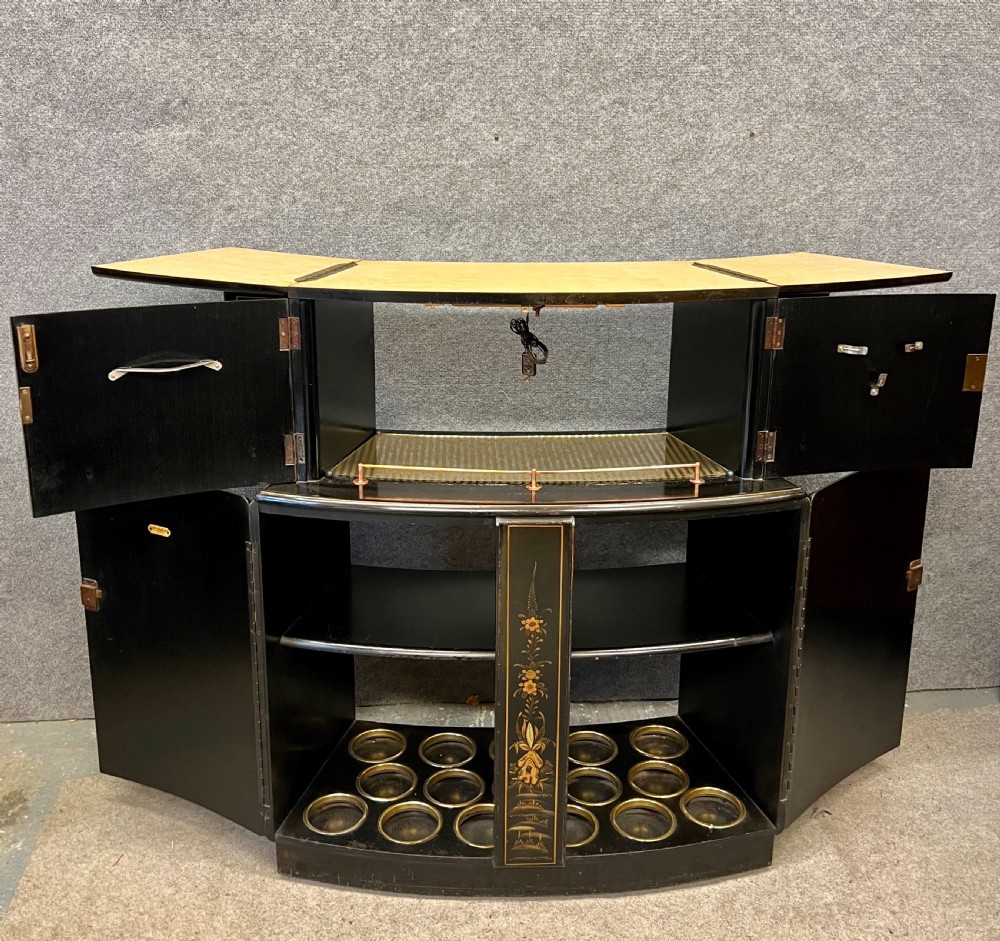A two-tier black lacquered Art Deco cocktail cabinet featuring hand-painted gold and polychrome Chinoiserie figures and landscapes. View II