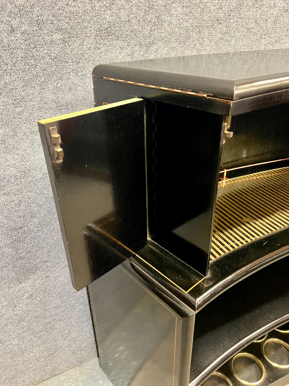 A two-tier black lacquered Art Deco cocktail cabinet featuring hand-painted gold and polychrome Chinoiserie figures and landscapes. View XII
