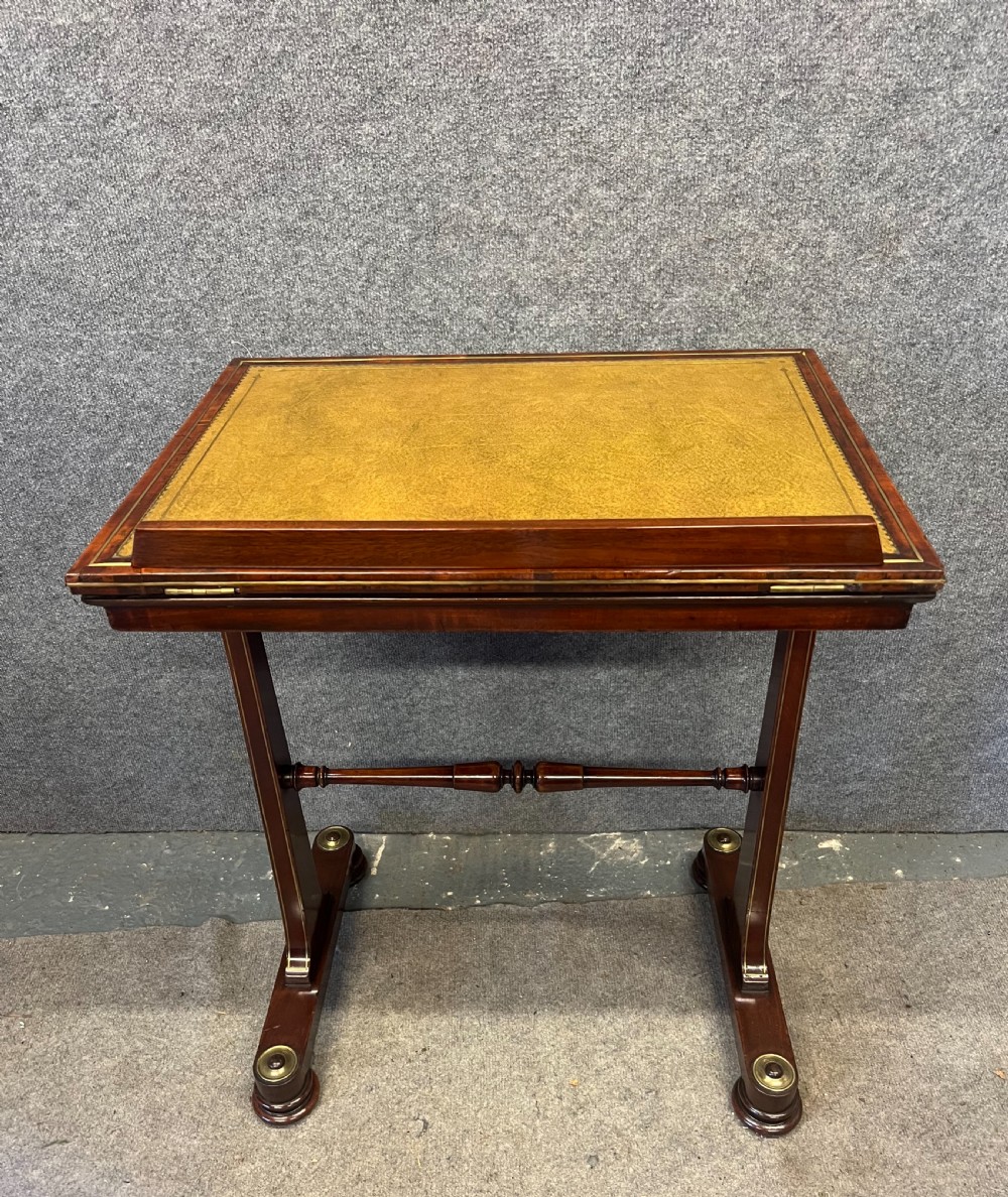 A Regency mahogany adjustable reading table with brass inlay and a gold tooled leather tilting top. View III