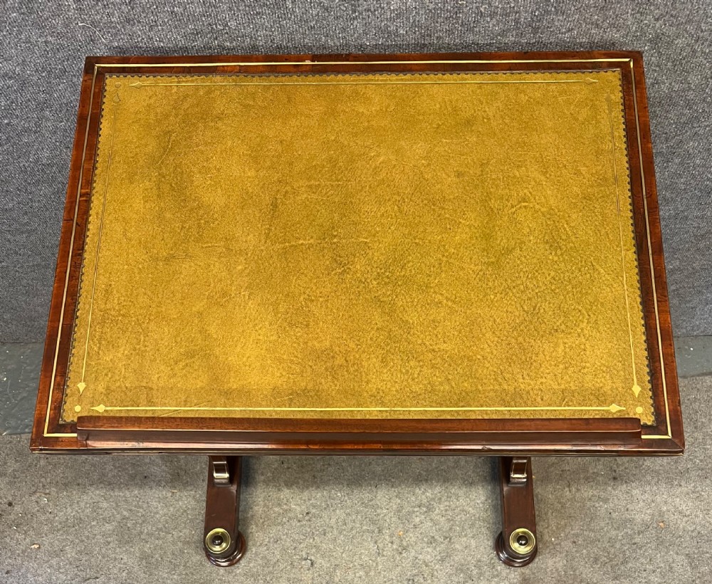 A Regency mahogany adjustable reading table with brass inlay and a gold tooled leather tilting top. View IV