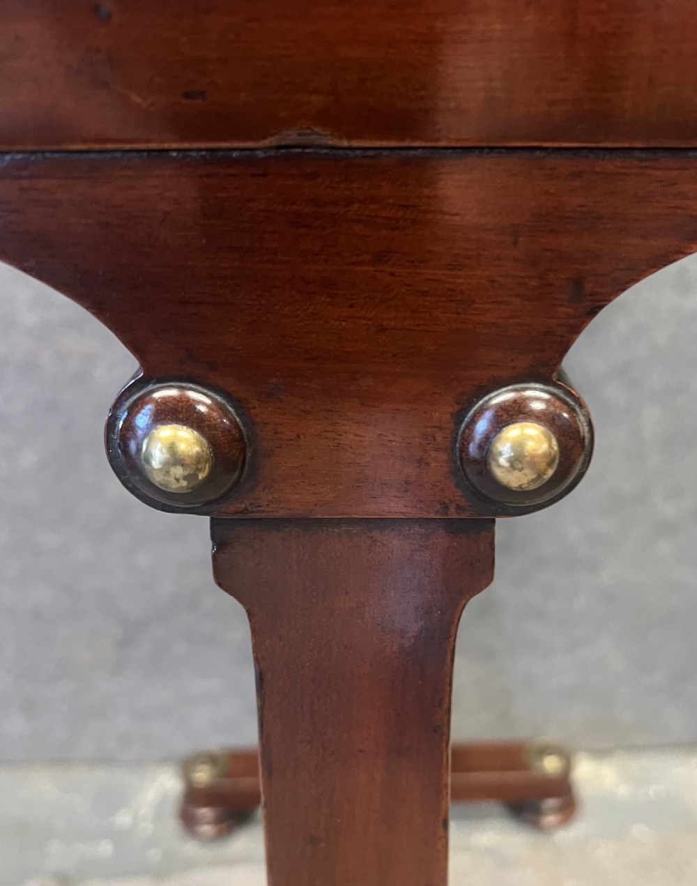 A Regency mahogany adjustable reading table with brass inlay and a gold tooled leather tilting top. View VIII