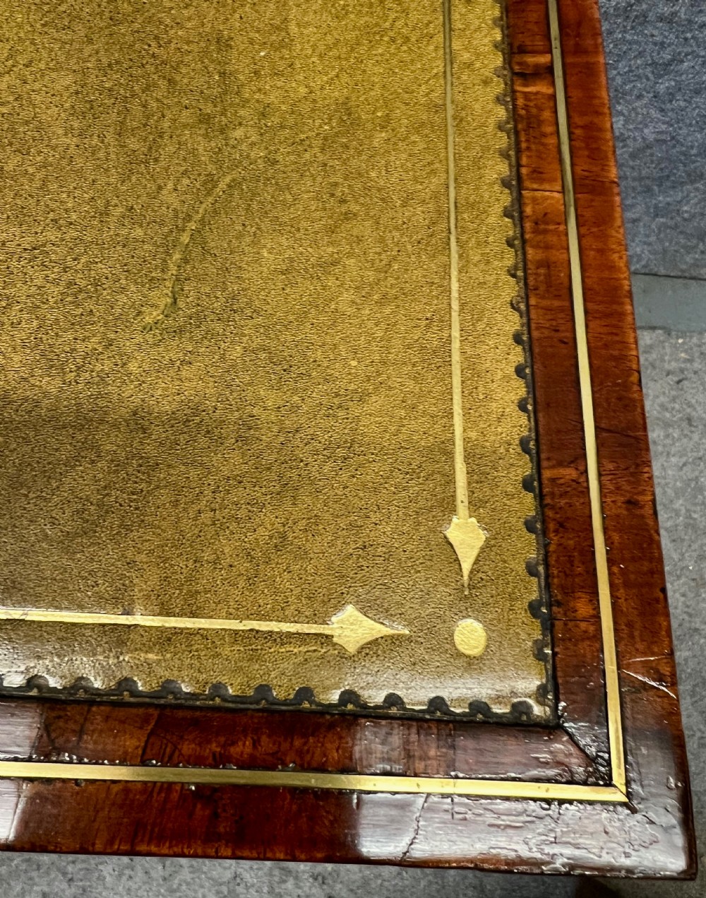 A Regency mahogany adjustable reading table with brass inlay and a gold tooled leather tilting top. View IX