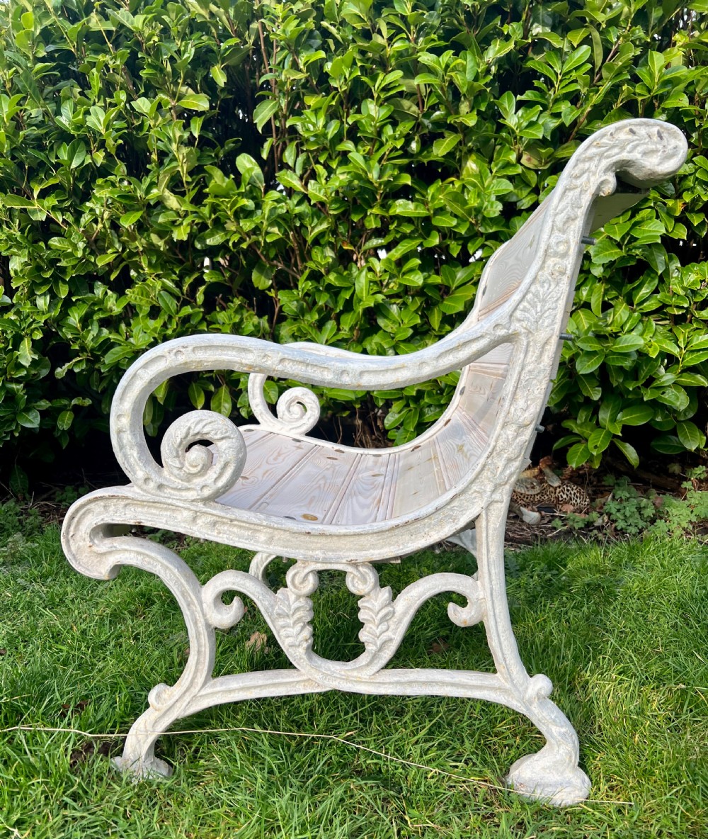 Set of four Victorian garden armchairs featuring white painted cast iron scrollwork frames and slatted timber seats. View III