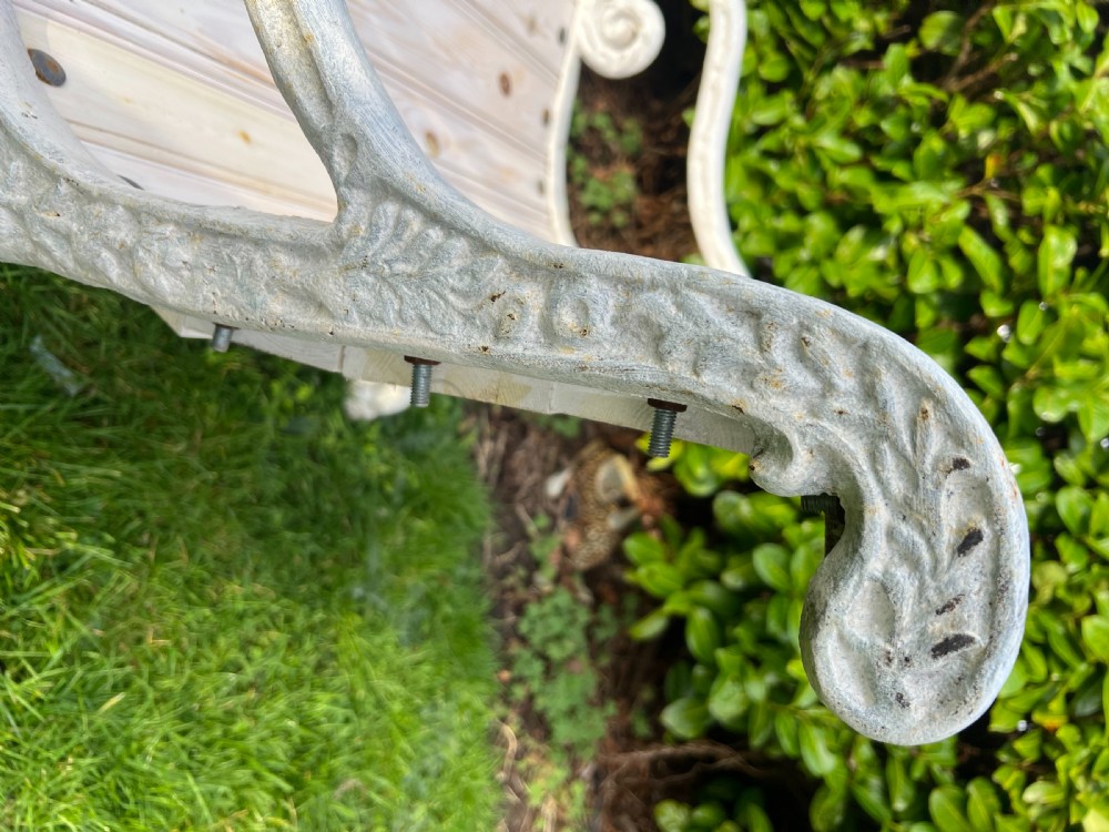 Set of four Victorian garden armchairs featuring white painted cast iron scrollwork frames and slatted timber seats. View V