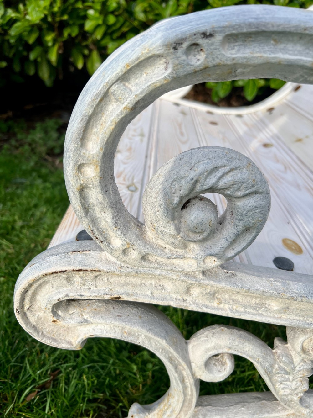Set of four Victorian garden armchairs featuring white painted cast iron scrollwork frames and slatted timber seats. View VI