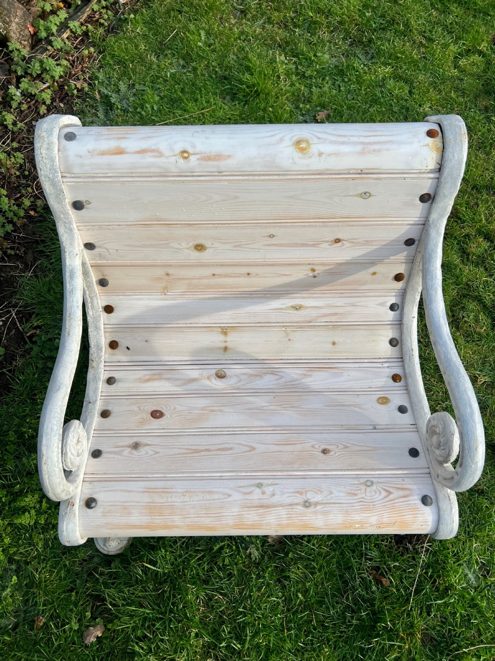 Set of four Victorian garden armchairs featuring white painted cast iron scrollwork frames and slatted timber seats. View VII