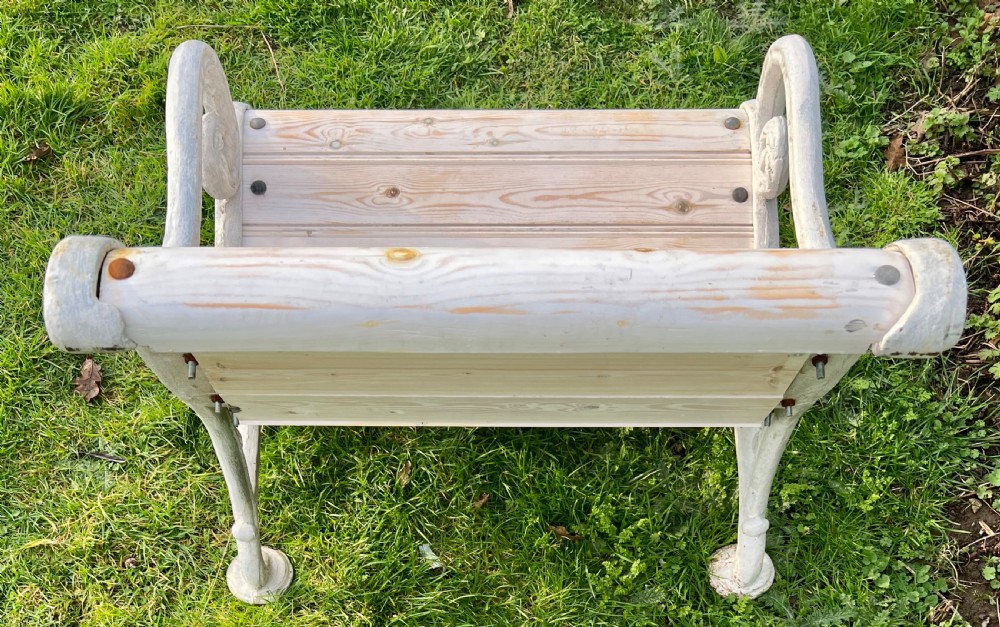 Set of four Victorian garden armchairs featuring white painted cast iron scrollwork frames and slatted timber seats. View VIII
