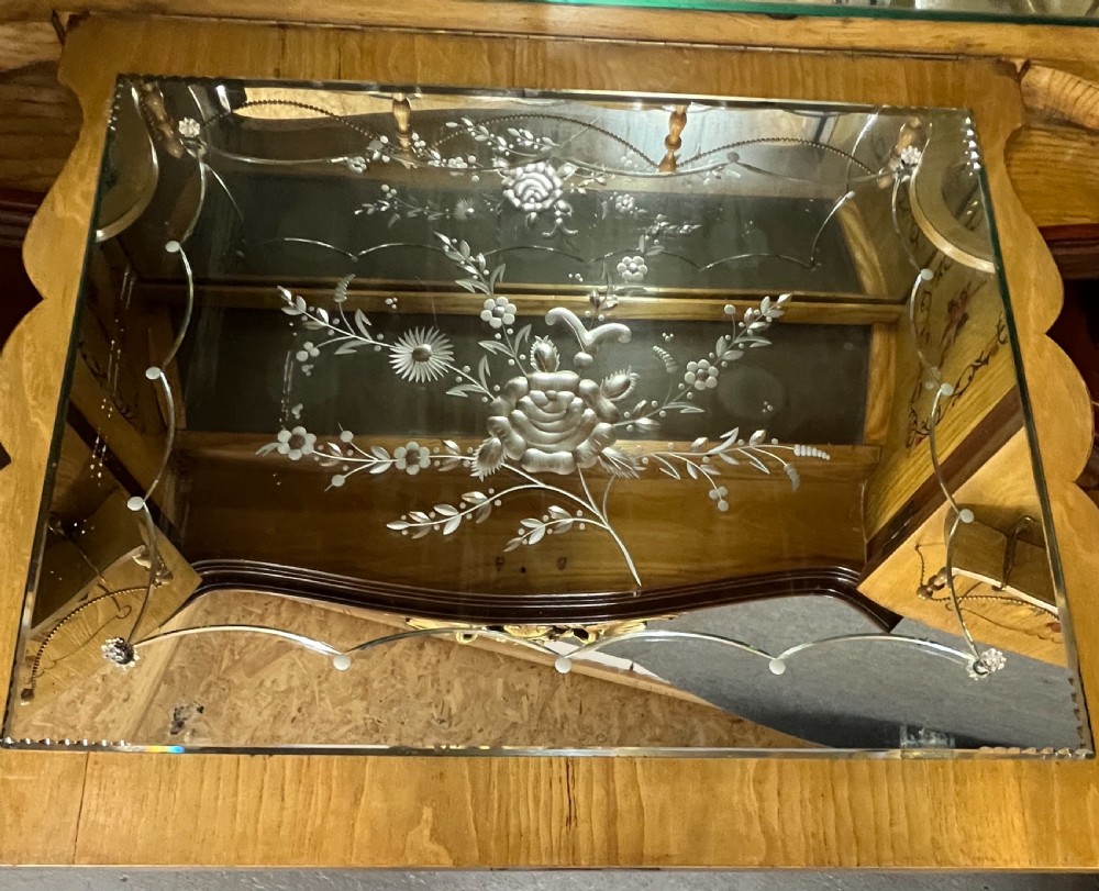 A two-tier dark walnut cocktail cabinet featuring intricate floral marquetry, a serpentine front, gilded carved accents, and turned legs with a contoured stretcher. View XII