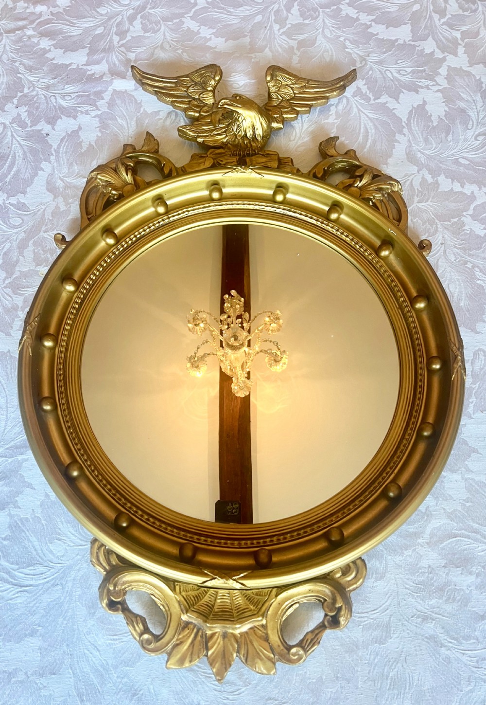 Regency Style Convex carved and Gilded Mirror.