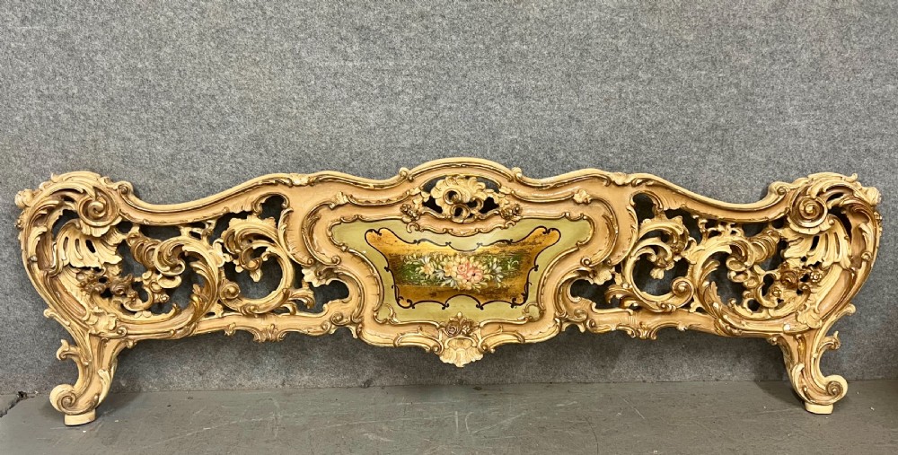 An ornate French Rococo style king size bed frame featuring cream painted and carved wood with gilded accents, sage green upholstered headboard panels, and hand-painted floral cartouches. View III