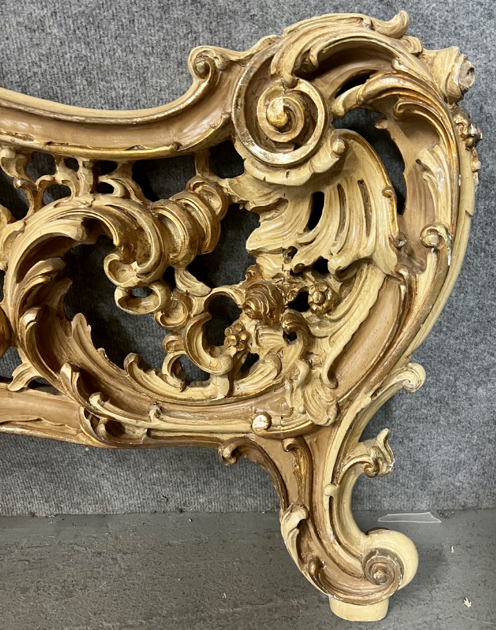 An ornate French Rococo style king size bed frame featuring cream painted and carved wood with gilded accents, sage green upholstered headboard panels, and hand-painted floral cartouches. View IX