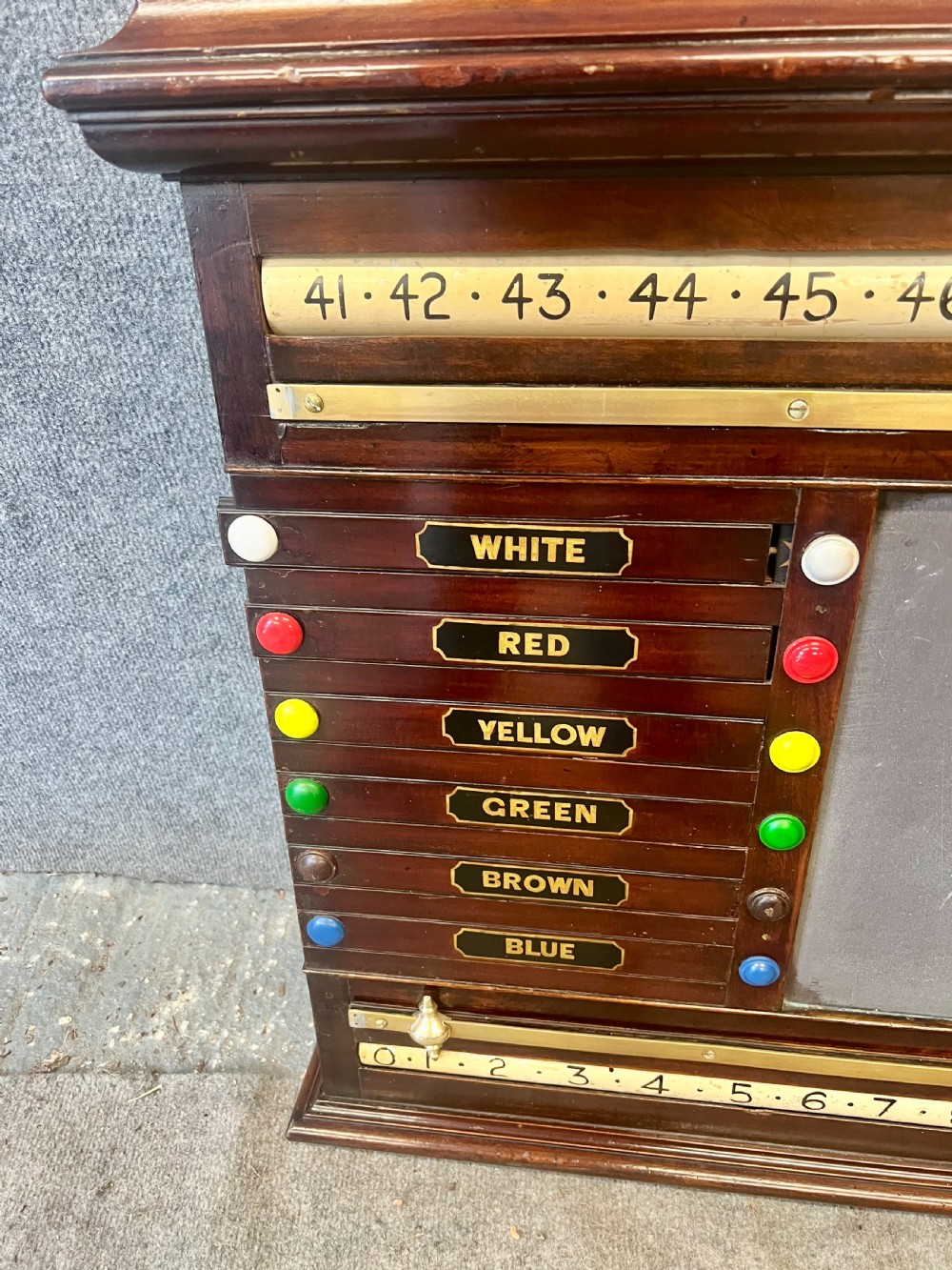 An antique dark mahogany snooker scoreboard featuring sliding pointer bars with coloured markers, brass fittings, and a central slate panel. View III