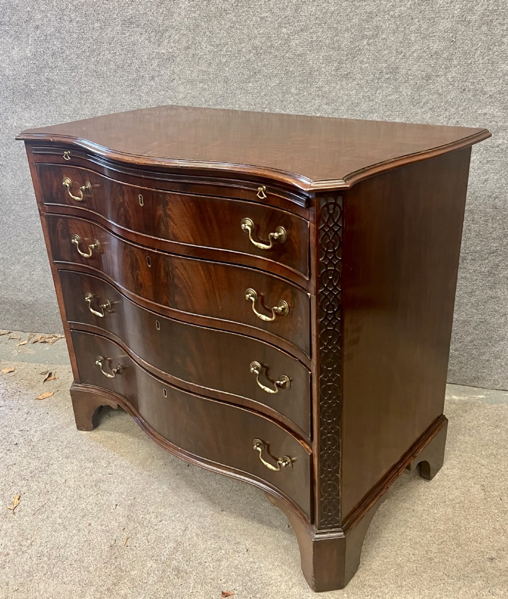 Antique Figured Mahogany Serpentine Shaped Chest of Drawers