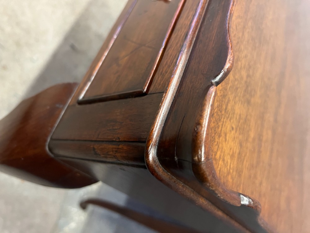 A Georgian mahogany silver table featuring a raised gallery top, a single drawer with brass handles, and slender cabriole legs. View III