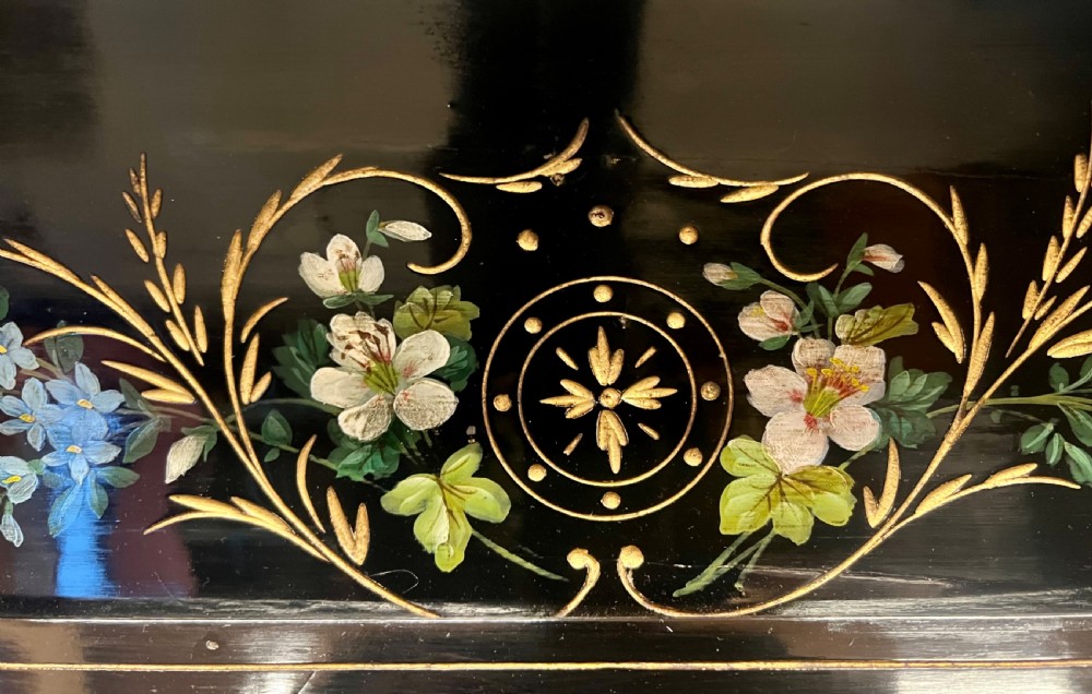 An Aesthetic Movement ebonised wooden overmantel mirror featuring hand-painted floral panels, gold foliage accents, and a curved top cresting. View VII