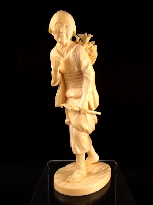 japanese meiji period ivory okimono of a fruit harvester - CATEGORY: ANTIQUE MISCELLANEOUS - DATED 1890