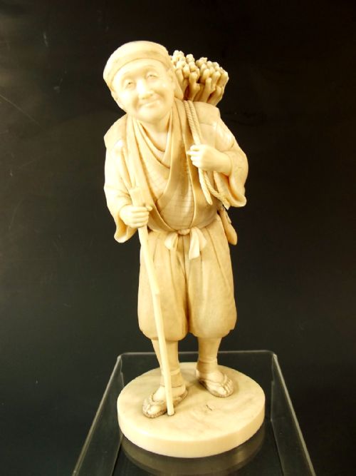 japanese meiji period ivory okimono of a wood gatherer signed - CATEGORY: ANTIQUE MISCELLANEOUS - DATED 1890