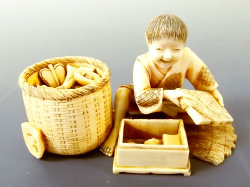 japanese meiji period ivory okimono boy with toys - CATEGORY: ANTIQUE MISCELLANEOUS - DATED 1890