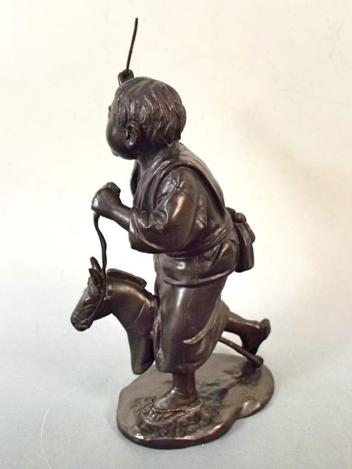 JAPANESE MEIJI PERIOD SIGNED BRONZE OF BOY WITH HOBBY HORSE OKIMONO - ADDITIONAL PHOTO 2