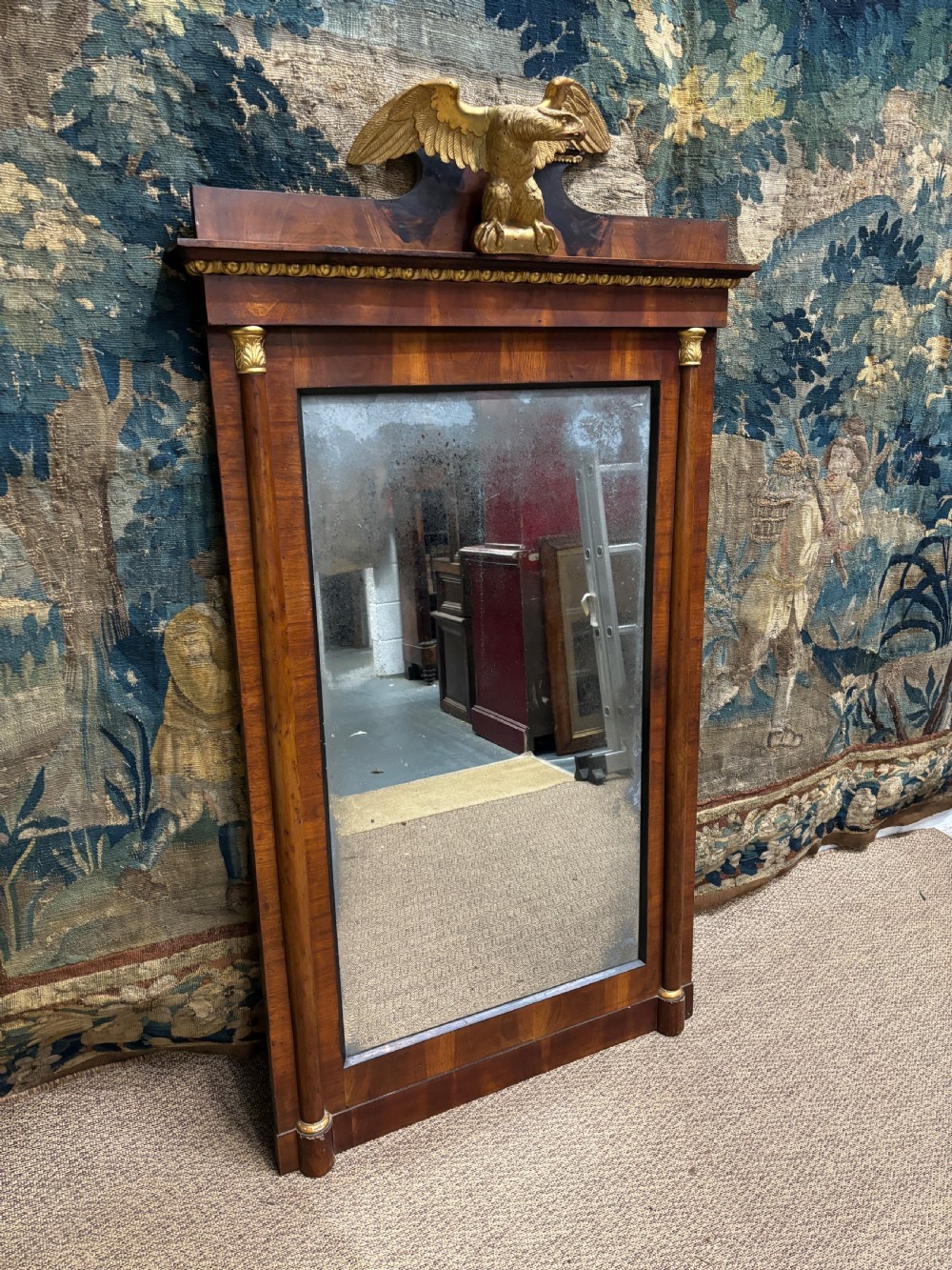 A rectangular Regency mahogany wall mirror with a carved gilded eagle cresting mounted at the top centre. View IV