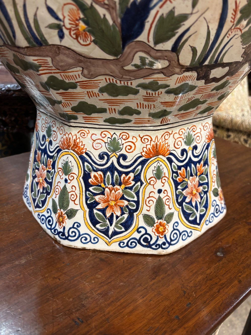 A large 19th-century polychrome Delft lidded jar decorated with hand-painted bird and floral patterns, featuring a domed lid with a finial. View II