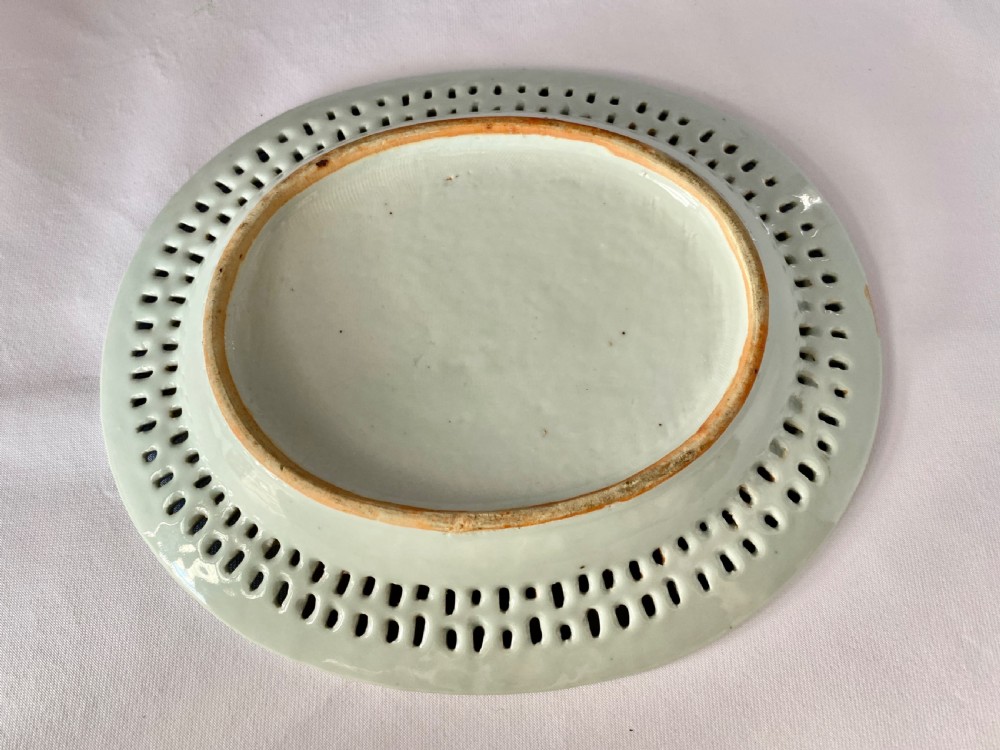 An oval blue and white porcelain Chinese export dish featuring a pierced reticulated border and a hand-painted landscape scene. View VI