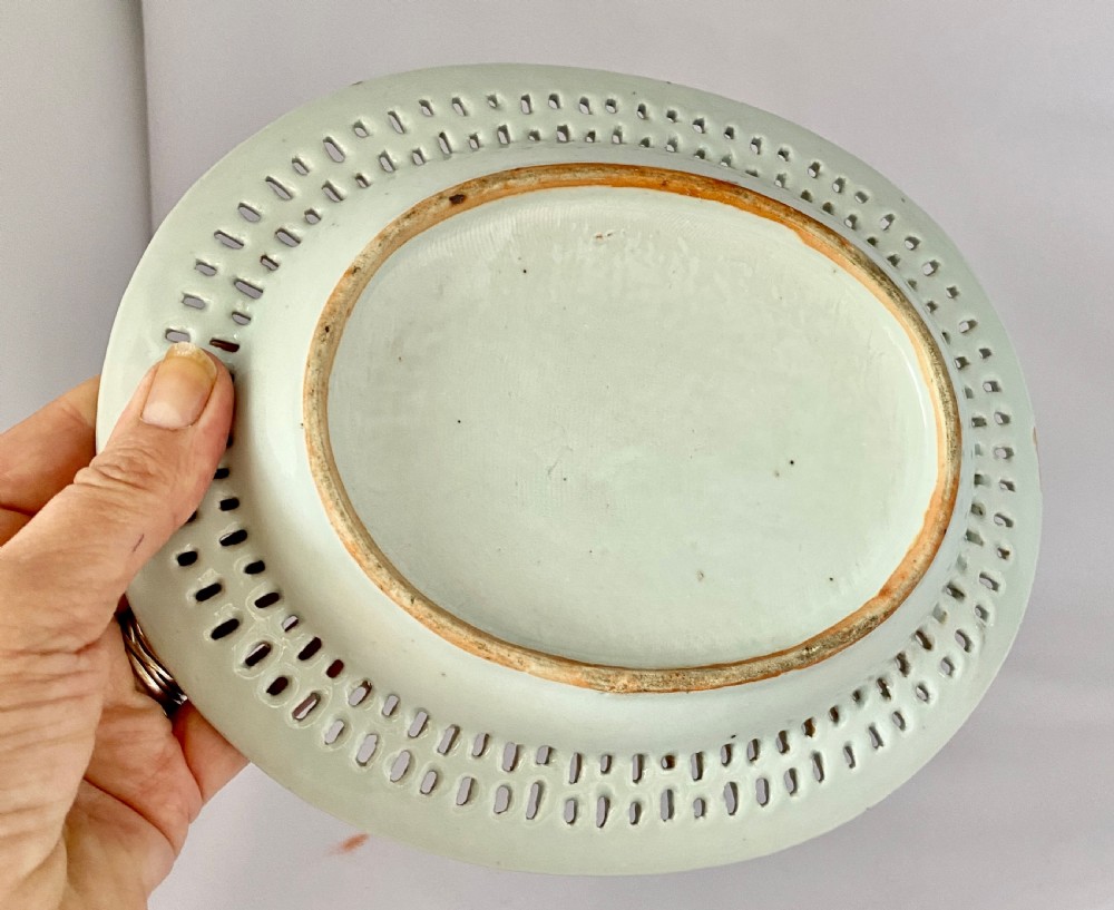 An oval blue and white porcelain Chinese export dish featuring a pierced reticulated border and a hand-painted landscape scene. View VIII