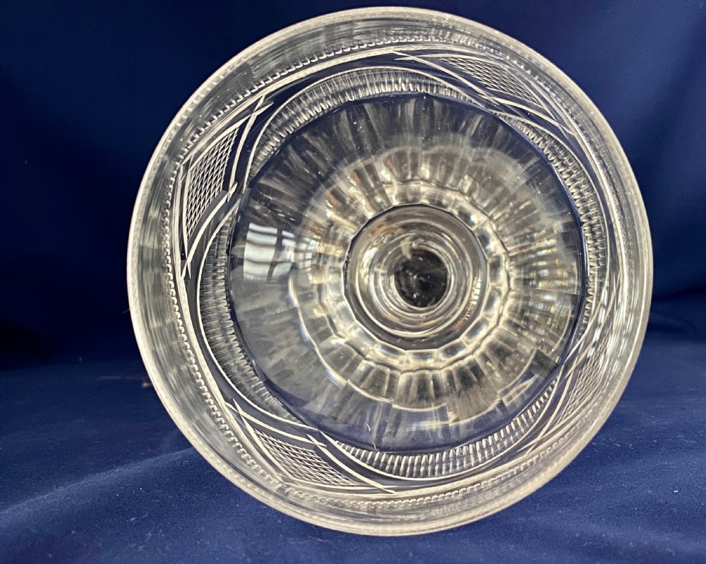 A large mid-Victorian clear cut glass rummer featuring a diamond pattern band above fluted cutting and a short knopped stem on a circular base. View IV