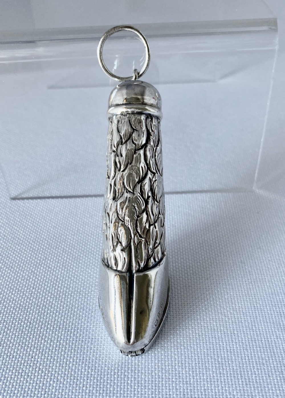 A Late Victorian sterling silver novelty vesta case fashioned in the form of a textured animal leg and hoof with a top suspension ring.