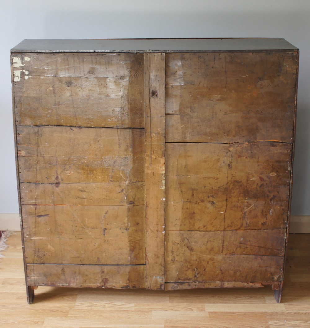 An 18th-century dark oak bureau featuring a slanted fall-front writing flap above four graduated drawers with brass handles. View VII