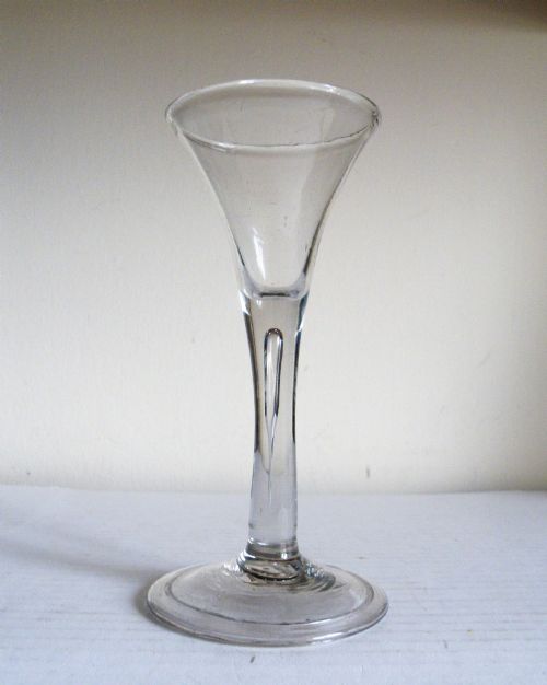 AN 18th CENTURY DRAWN STEM WINE GLASS CIRCA 1740