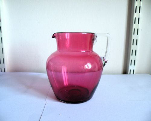A VICTORIAN CRANBERRY GLASS JUG