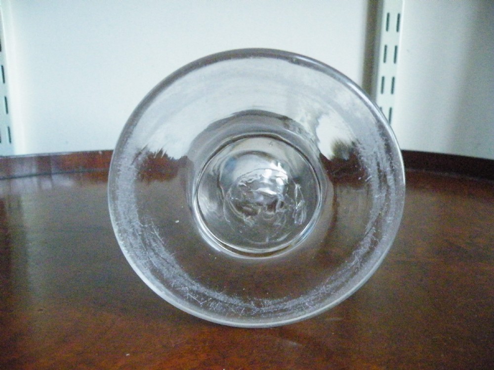 A nineteenth-century clear glass sweetmeat glass featuring a wide conical flared bowl, a short sturdy stem, and a flat circular foot. View IV