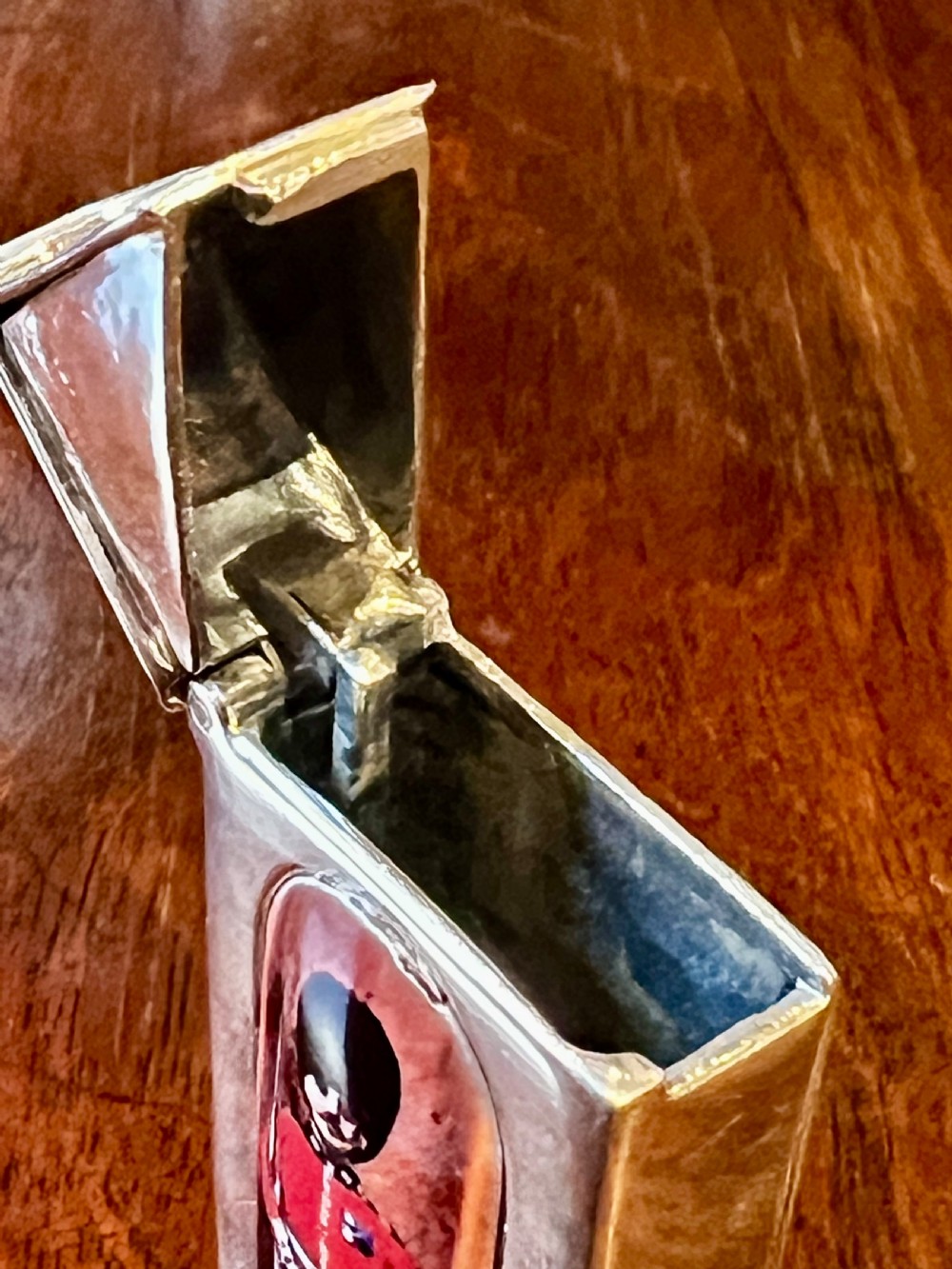 A small vertical silver vesta case shaped like a sentry box, featuring a painted enamel depiction of a guardsman on the front. View V