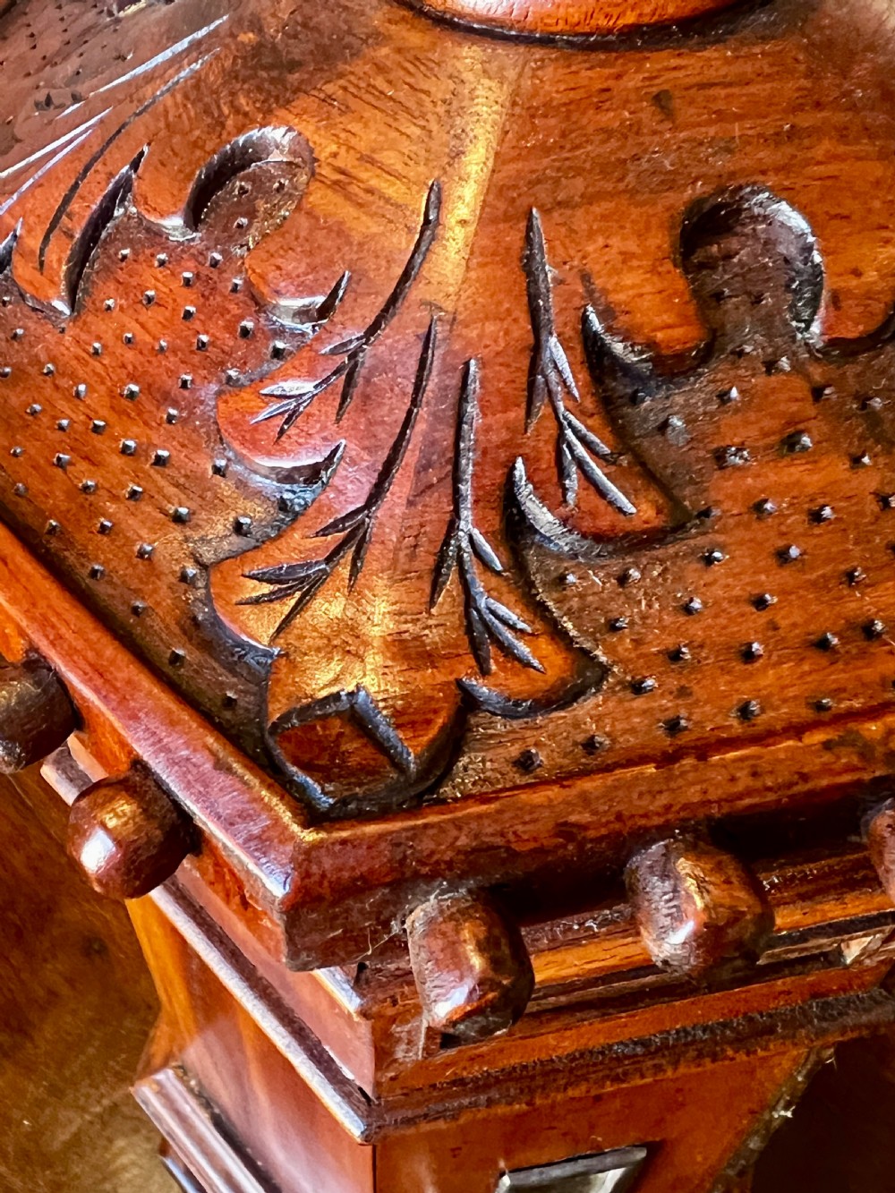 An octagonal wooden postal box featuring carved detailing on the domed roof, a brass letter slot, and a hinged locking door. View IX