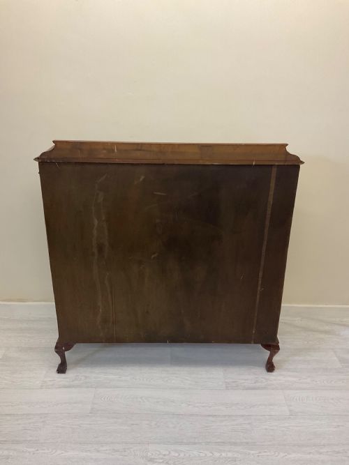 fig 6. An early 20th-century mahogany glazed display cabinet with decorative astragal glazing bars, cabriole legs, and ball-and-claw feet.