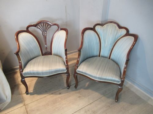 A Similar  Pair of Edwardian  Mahogany Arm Chairs