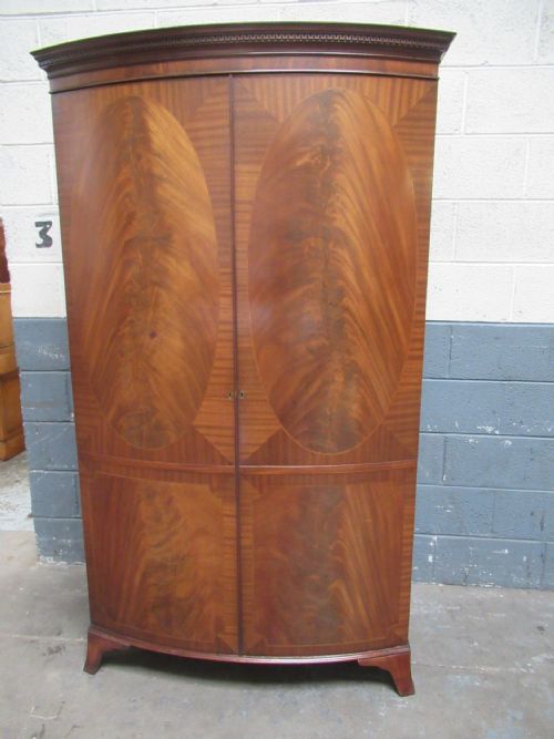 Mahogany  Bow Front Wardrobe in the Antique Style.