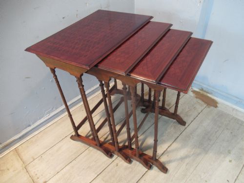 EDWARDIAN PERIOD MAHOGANY NEST OF FOUR TABLES