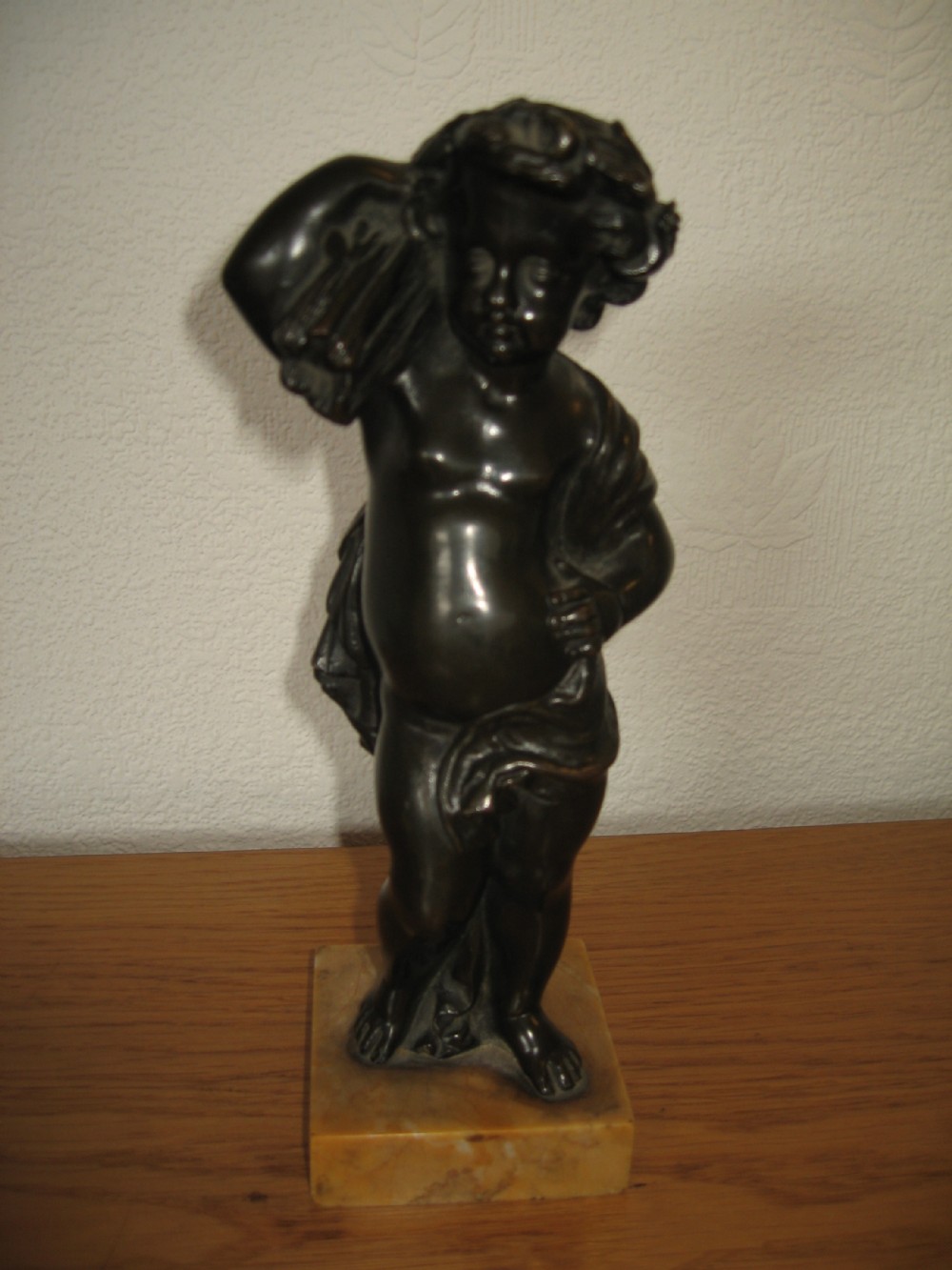 Small bronze cherub  figure