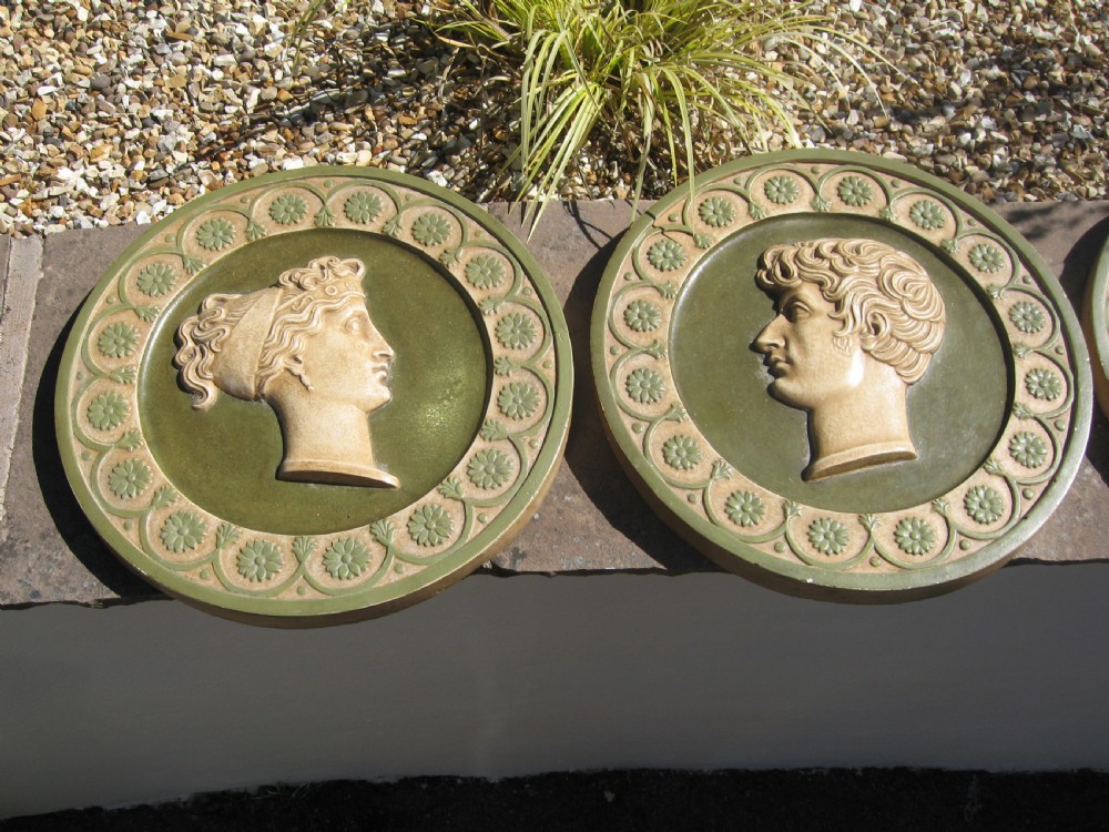 Set of four  circular roman  style  wall plaques View II
