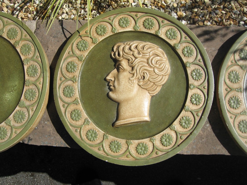 Set of four  circular roman  style  wall plaques View III