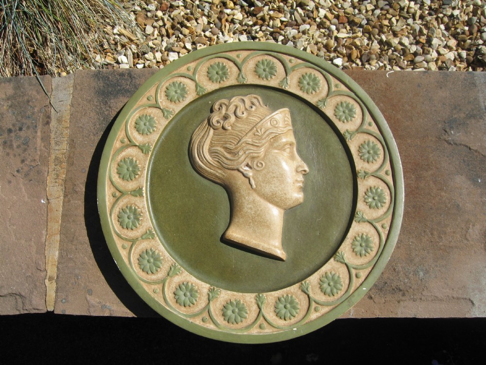 Set of four  circular roman  style  wall plaques View V