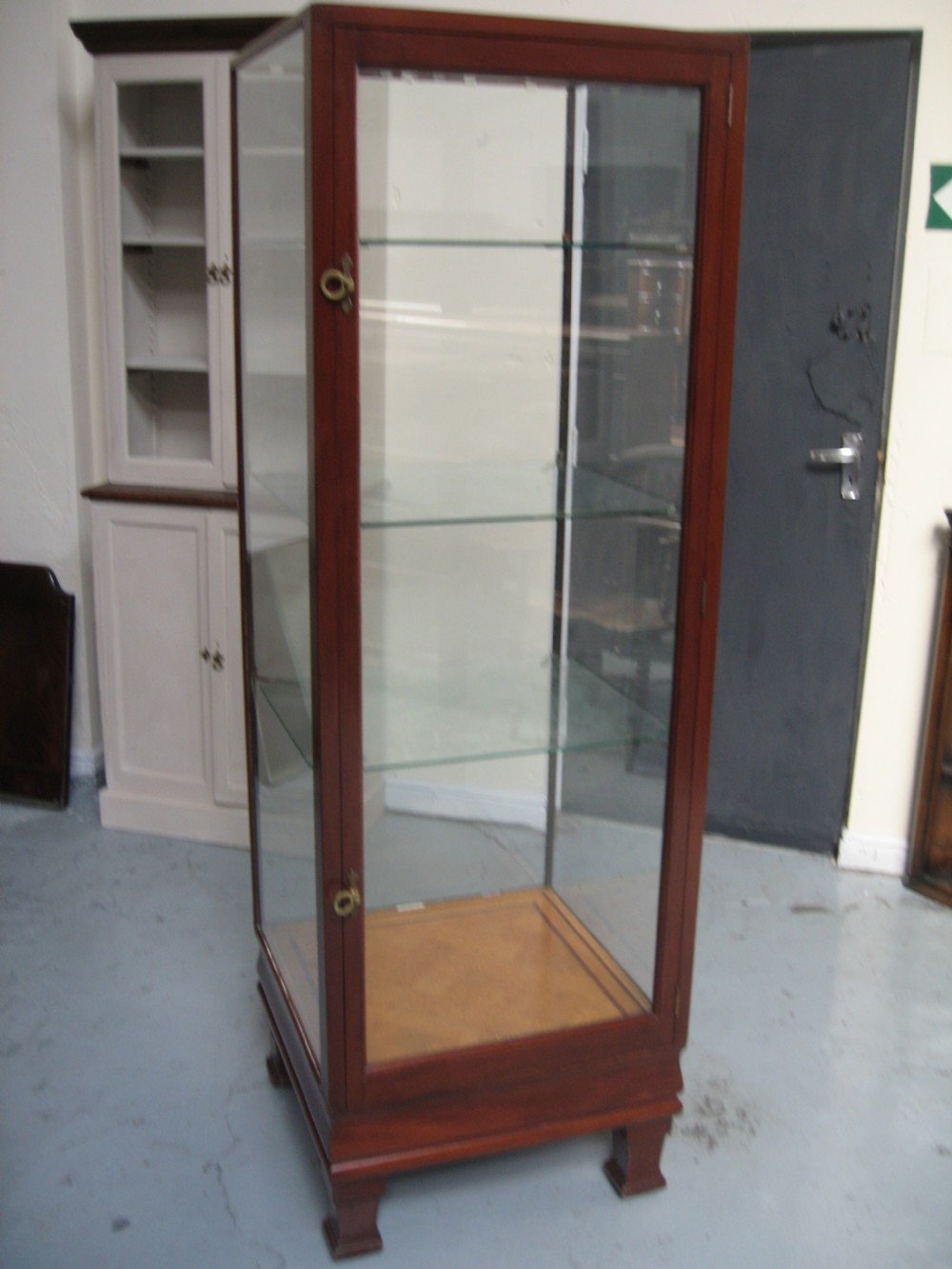 Tall mahogany shop display cabinet