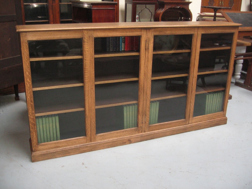 Large light oak  four door bookcase