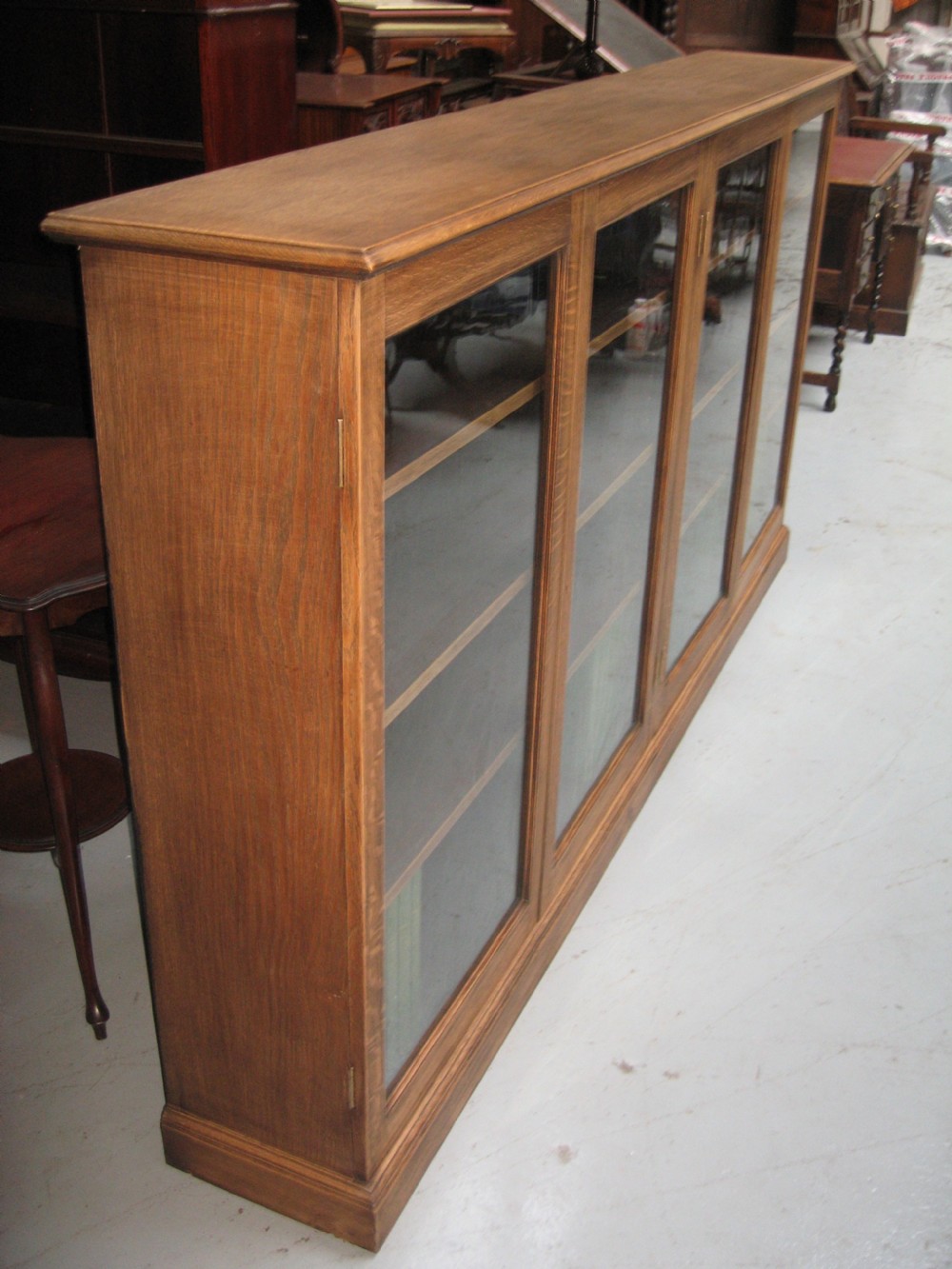 Large light oak  four door bookcase View VI