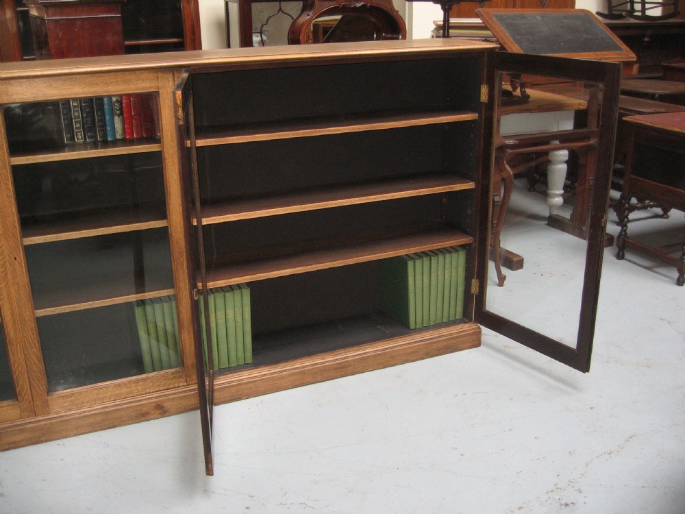 Large light oak  four door bookcase View IX